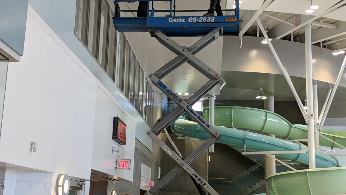 Scissor Lift Used to install new control damper in natatorium.